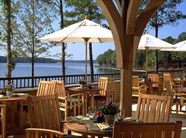 8 foot wood market style umbrellas in restaurant setting with fine teak furniture table and chairs